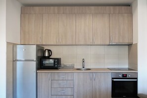 Enjoy cooking in this well-equipped kitchen with a refrigerator, microwave, and dishwasher.