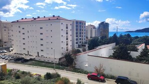 Residential building with modern architecture, offering scenic views and potential access to amenities like parking and communal areas.