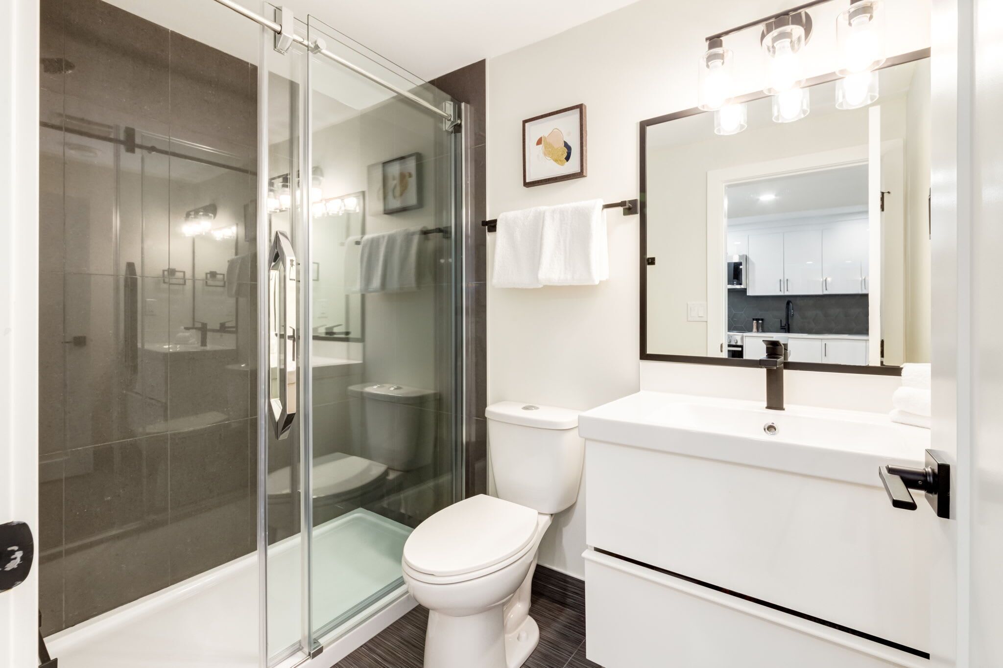 Shower, hair dryer, towels, shampoo