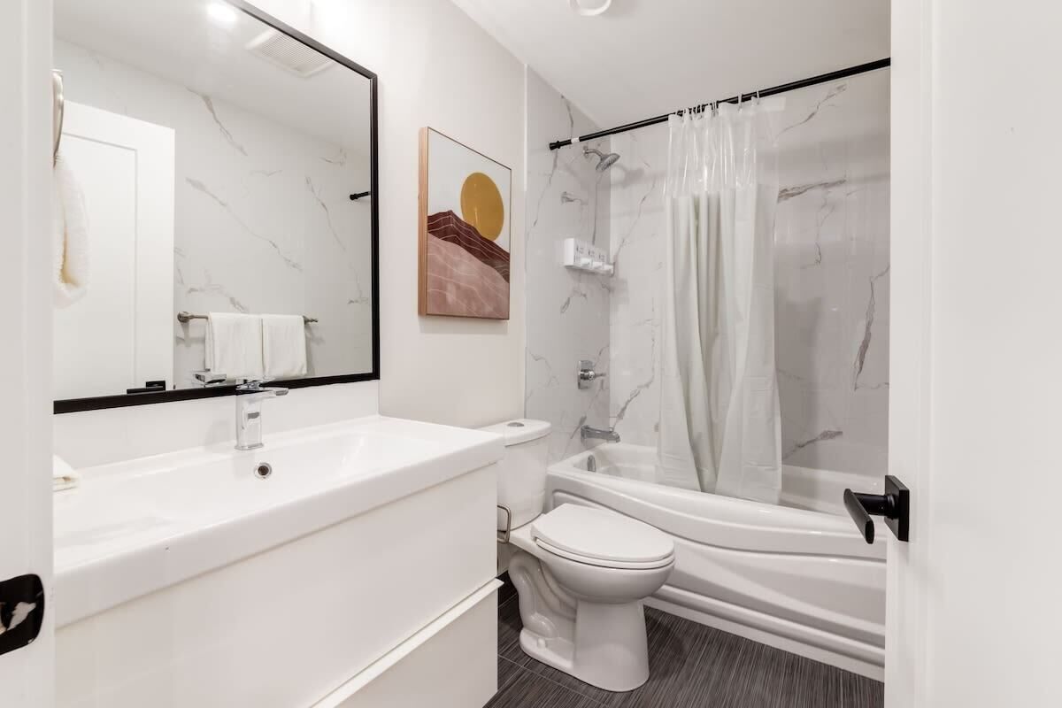 Shower, hair dryer, towels, shampoo