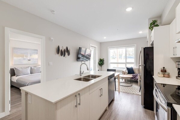 1 bedroom, desk, iron/ironing board, travel crib