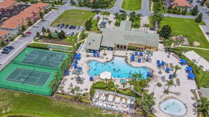 An aerial view of a resort with a large pool, tennis courts, and a water slide. - Amazing Townhouse Sleep10 Resort (Kissimmee)