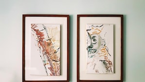 Two framed abstract paintings on a wall. - Amazing Place by Liverpool St Station (London)