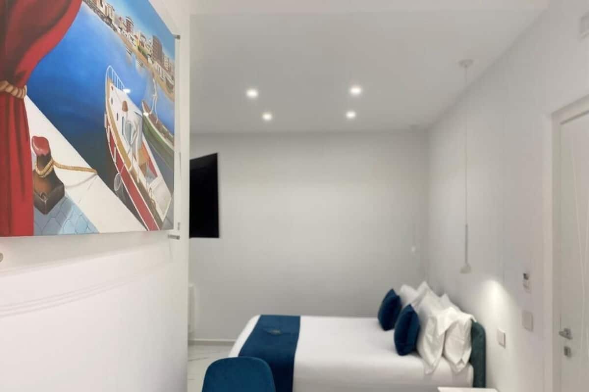 Deluxe kamer, 1 queensize bed met slaapbank, niet-roken, privébadkamer | 1 slaapkamer, luxe beddengoed, pillowtop-bedden