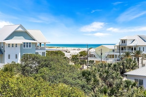 A coastal property with a beach view, featuring a large house with a balcony and a smaller attached structure. - 400 Feet to the Beach, Private Pool, Gulf Views, Renovated Kitchen, 5 Bikes (Inlet Beach)