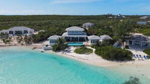 A beachfront property with multiple houses, a swimming pool, and a sandy beach. - BEACHFRONT! Best Location on Private Lazy River Sand Bar.  Always Calm Water! (Moore Hill)