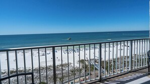 A balcony with a view of a beach and ocean. - Mariners Retreat High Rise Beach Living in Pcb! (Panama City Beach)