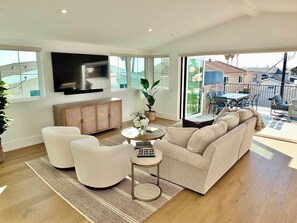 House, Multiple Beds, Patio, Ocean View (Beach Paradise) | Living area | 42-inch flat-screen TV with digital channels, fireplace - Beach Paradise Stunning 3-story in Long Beach! (Long Beach)