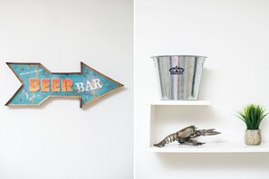 A wall-mounted sign with the words "BEER BAR" and a metal bucket with a logo. - One minute walk to the beach! (Luquillo)