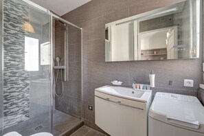 Shower, hair dryer, towels, soap