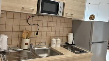 Fridge, microwave, cookware/dishes/utensils