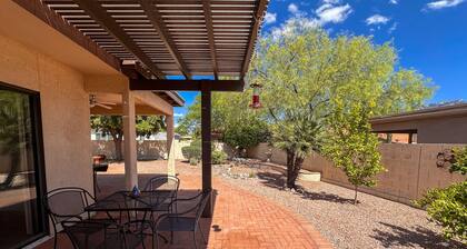 Mountain-view home with shaded patio, large yard, on-site golf & tennis