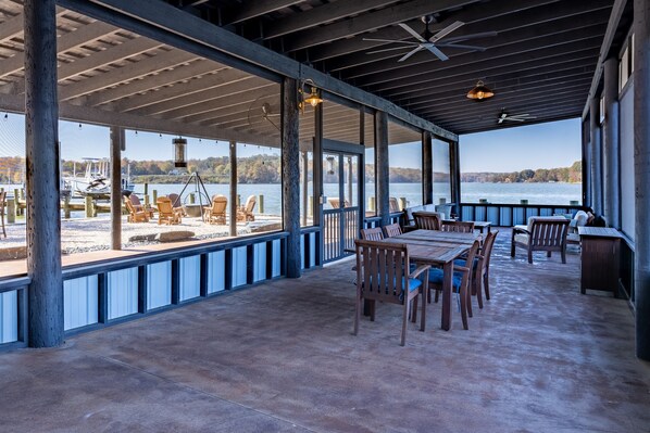 Enjoy a meal with a view of the water and boats from this outdoor dining area.