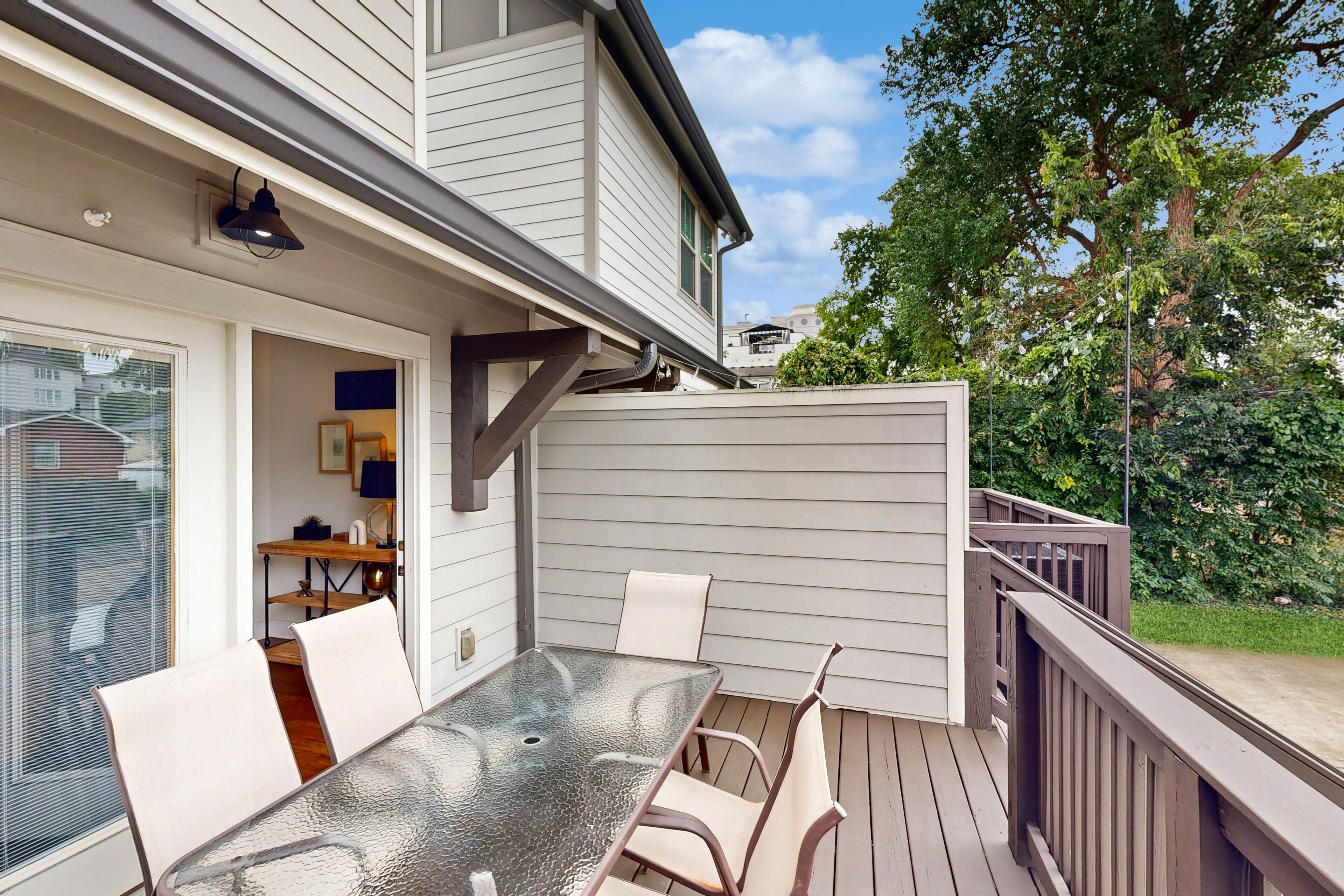 Music City townhome with back deck, open layout, smart TVs, W/D, & central AC