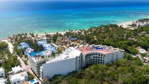 A resort with multiple buildings, a beach, and a pier. - Marila - Luxury 3 BR - Ocean View & Pool (Playa del Carmen)