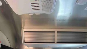 A compact kitchenette with a microwave, stove, and sink. - Airstream - 15 Minutes to Kings Canyon (Dunlap)