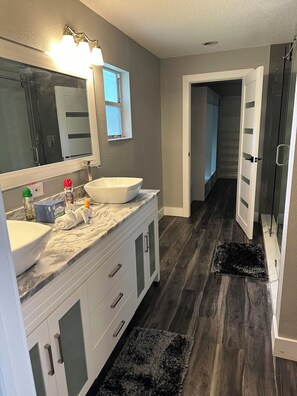 Shower, hair dryer, towels, soap