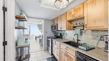 Fridge, microwave, stovetop, coffee/tea maker