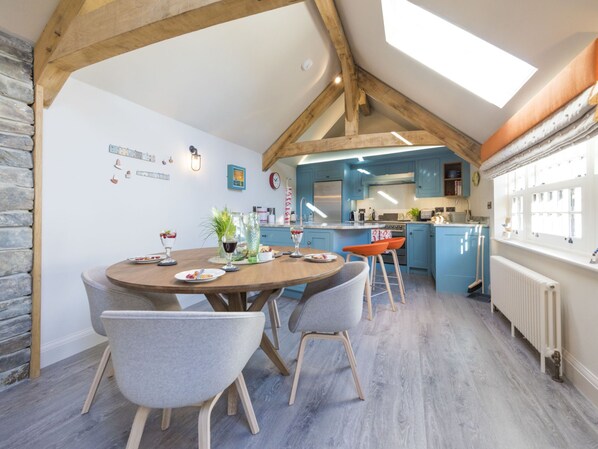 Enjoy cooking in this well-equipped kitchen with a central island, sink, and stove.