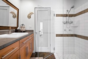 Shower, hair dryer, towels, shampoo