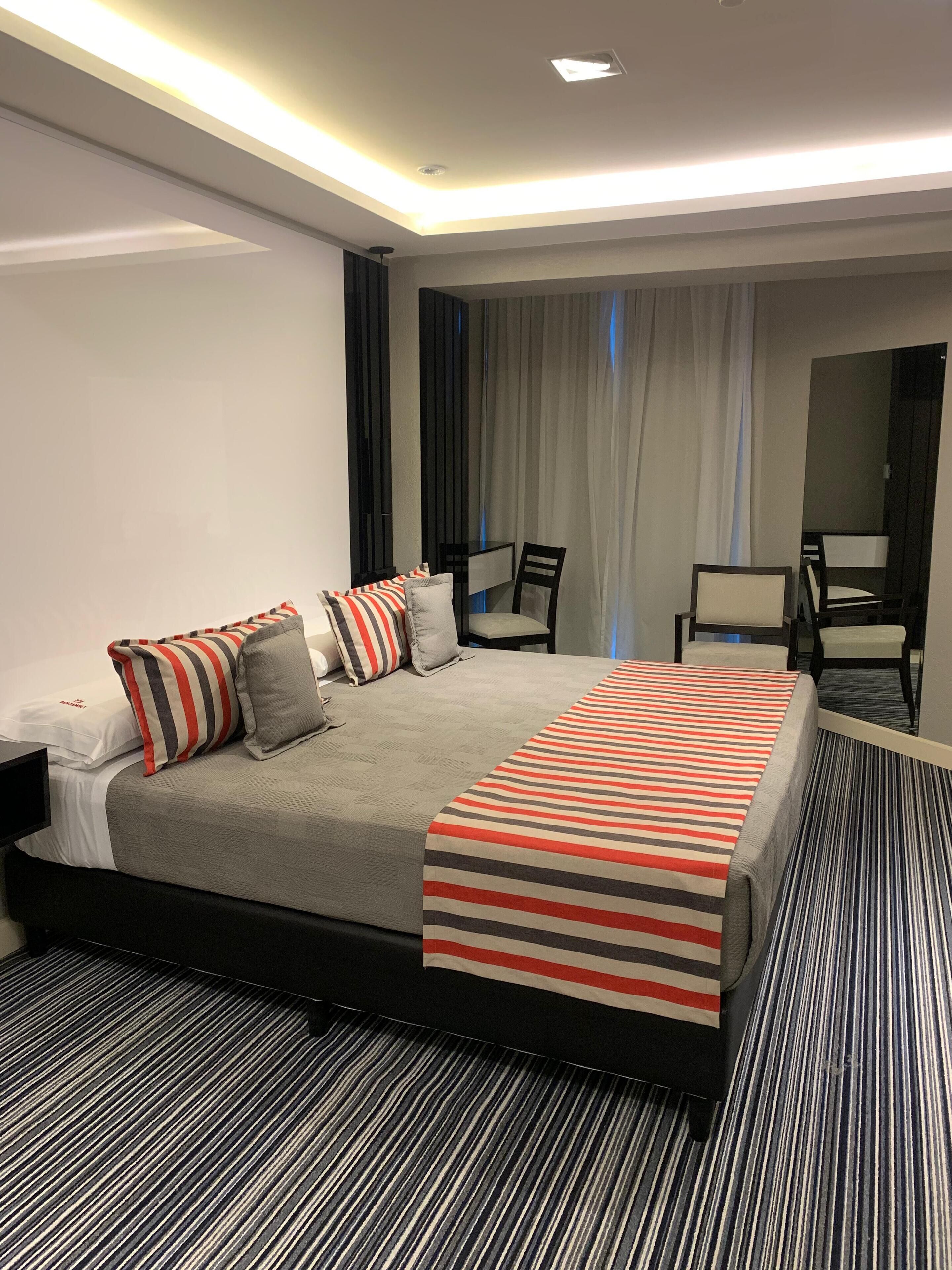 Premium bedding, down comforters, pillowtop beds, minibar