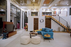 Exclusive Villa | Living area | Flat-screen TV