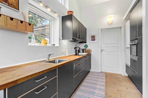 Summer house brimming with activity and coziness.