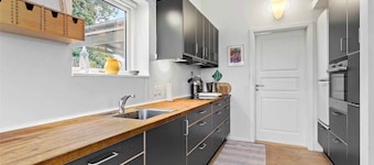 Summer house brimming with activity and coziness.