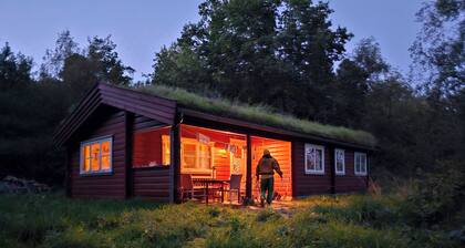 Charming Norwegian log cabin with grass roof