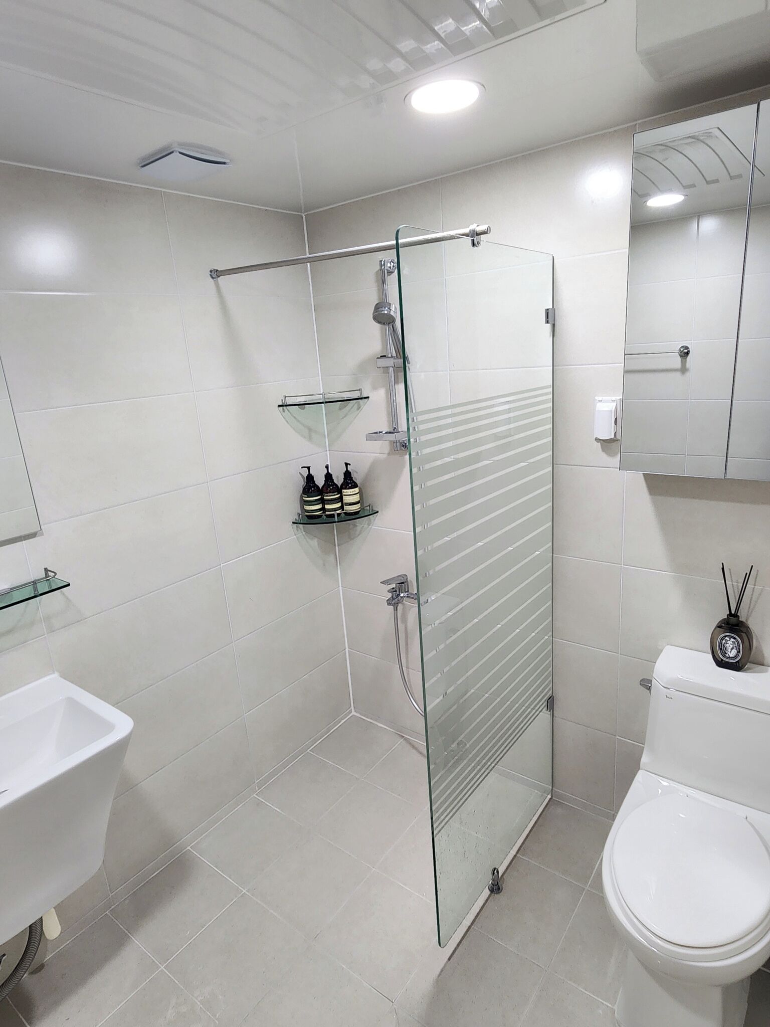 Shower, hair dryer, slippers, towels