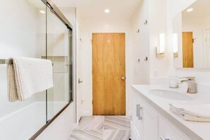 Shower, hair dryer, towels, shampoo