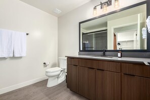 A bathroom with a toilet, a sink, a mirror, and a towel rack. - Macallister 2008|Heated Pool|Close 2 Golf|BBQ|View (Scottsdale)