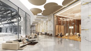 A modern lobby with marble flooring, seating areas, and a coffee bar. - Wyndham Ion Majestic Genting Highlands (Genting Highlands)