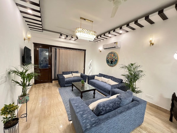 Superior Apartment | Living area | 55-inch LED TV with satellite channels - BedChambers Serviced Apartments South (New Delhi)