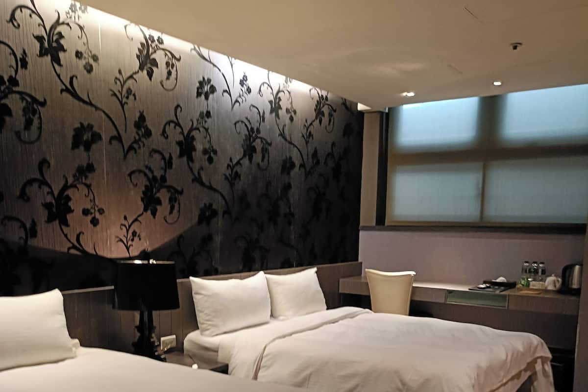 Kamar Triple Deluks | Selimut bulu angsa dan seprai linen