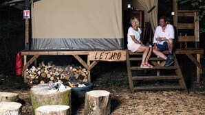 A rustic cabin with a large canvas awning labeled "LETHO". - Dormir au Chant des Loups - 1 (Sury-aux-Bois)