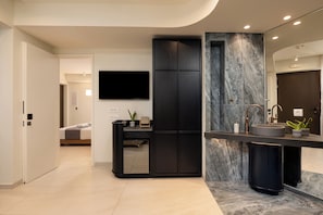 Junior Suite | Living area | 40-inch flat-screen TV with cable channels