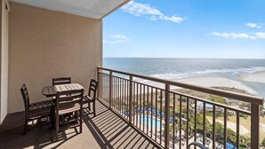 A balcony with a view of the beach and ocean. - Beachfront Serenity 1 Bedroom 2 Bathroom Escape (North Myrtle Beach)