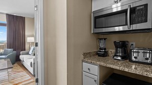 A compact hotel kitchen with a microwave, toaster, coffee maker, and a small refrigerator. - Beachfront Serenity 1 Bedroom 2 Bathroom Escape (North Myrtle Beach)