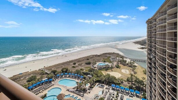 A resort with multiple swimming pools, a beach, and a high-rise building. - Beachfront Serenity 1 Bedroom 2 Bathroom Escape (North Myrtle Beach)