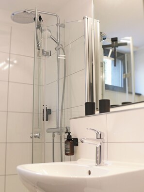 Shower, hair dryer, towels, soap
