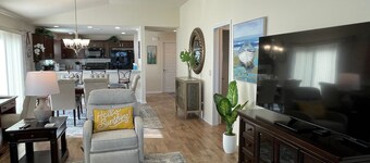 Stylish villa with golf cart, BBQ, near pool & shops in tranquil setting!