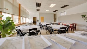 A spacious dining hall with multiple tables and chairs, large windows, and a clean, modern interior. - 20 Mi to Dtwn Pittsburgh: Pet-friendly Apartment (New Kensington)