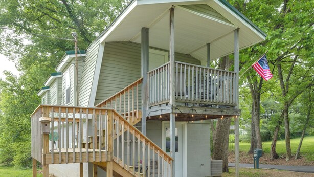A two-story house with a covered porch and a wooden staircase. - 5 Mi to Columbia: Pet-friendly Culleoka Home (Culleoka)