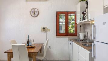 Family Studio (Holiday Home Sladonja - Apartment 02) | Private kitchen | Fridge, microwave, stovetop, dishwasher