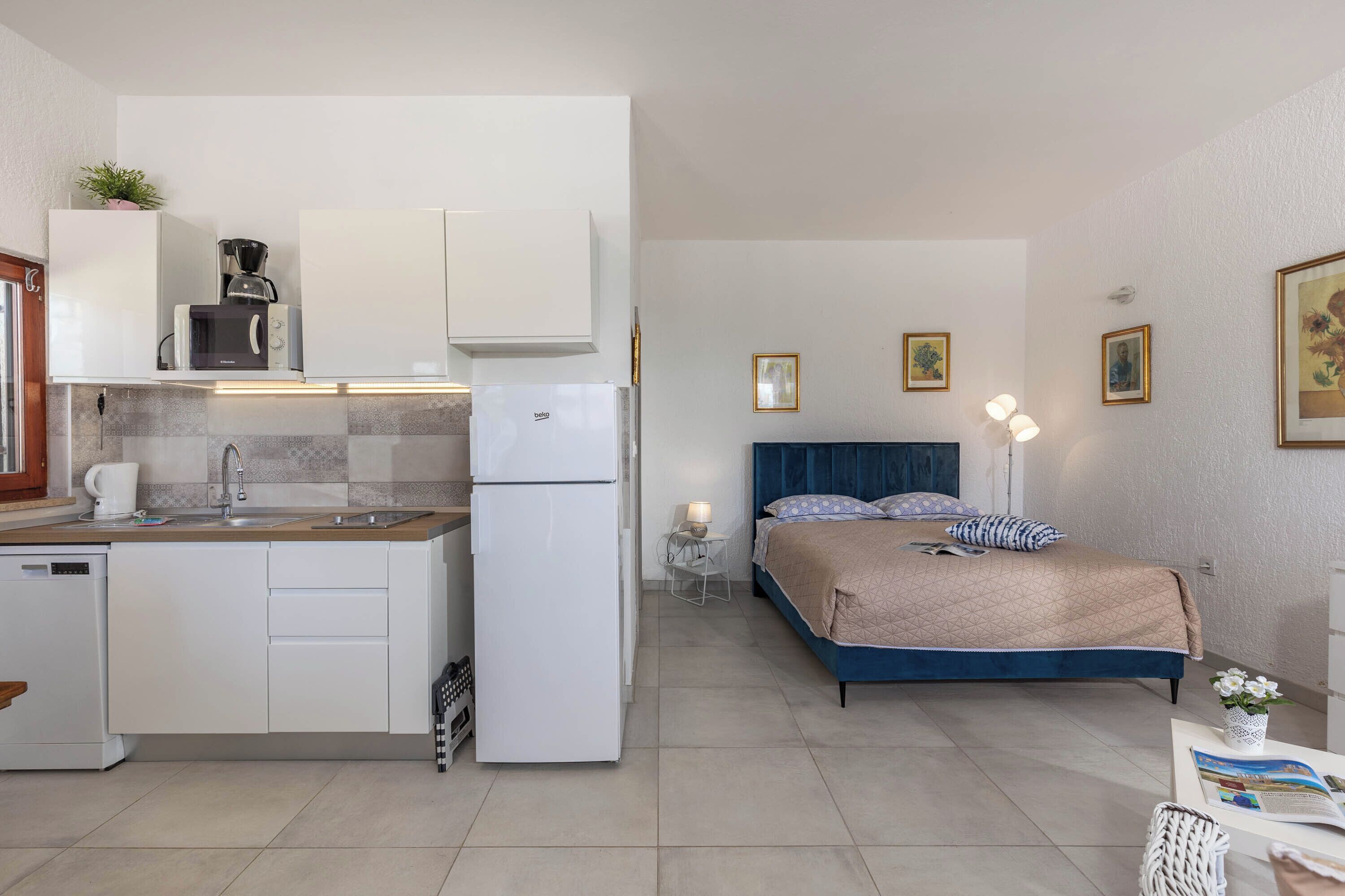 Family Studio (Holiday Home Sladonja - Apartment 02) | Living area | 21-inch flat-screen TV with satellite channels