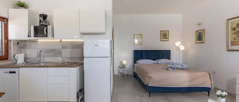 Family Studio (Holiday Home Sladonja - Apartment 02) | Living area | 21-inch flat-screen TV with satellite channels