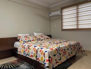 Enjoy a restful stay in this cozy room with a single bed, air conditioning, and a window with blinds.