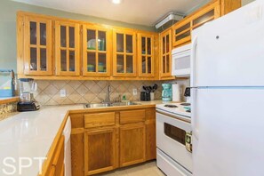 Condo, Multiple Beds, Balcony, Pool View | Private kitchen | Fridge, microwave, oven, stovetop