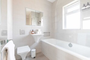 Basic Apartment | Bathroom | Hair dryer, towels, soap, shampoo - Sleek Scandi-inspired 2BD Flat, Fulham (London)
